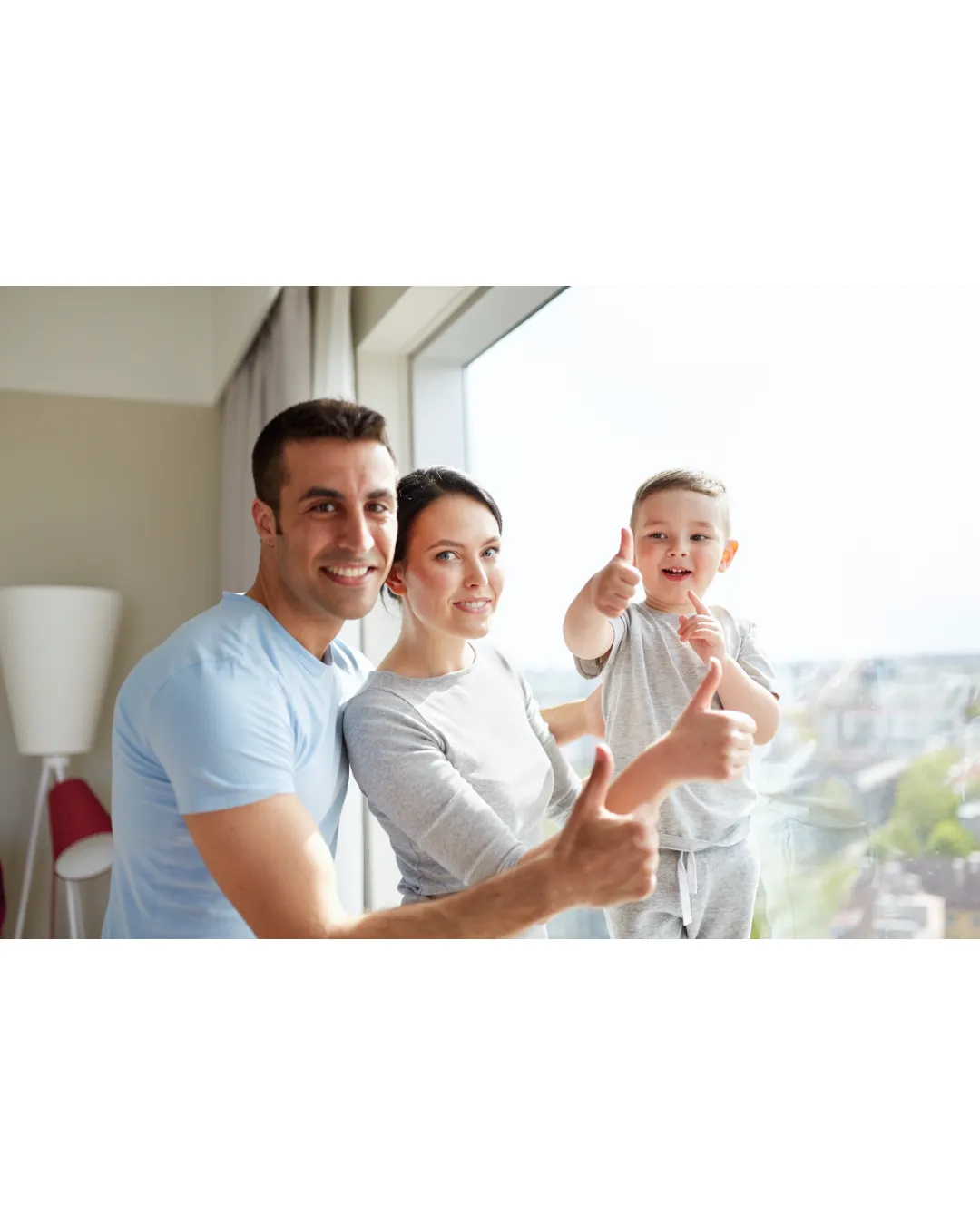 Happy family giving thumbs up