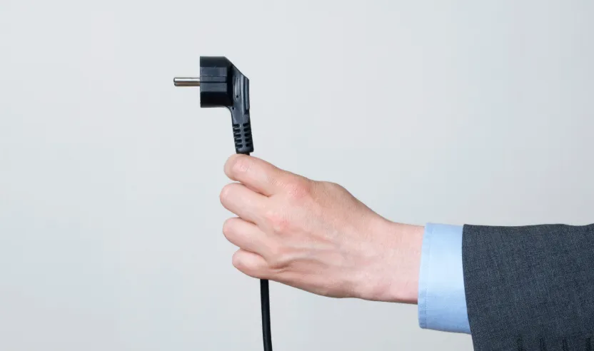 men holding power plug