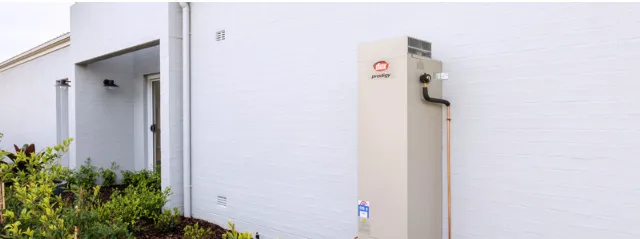 Installed gas water heater with compact deign