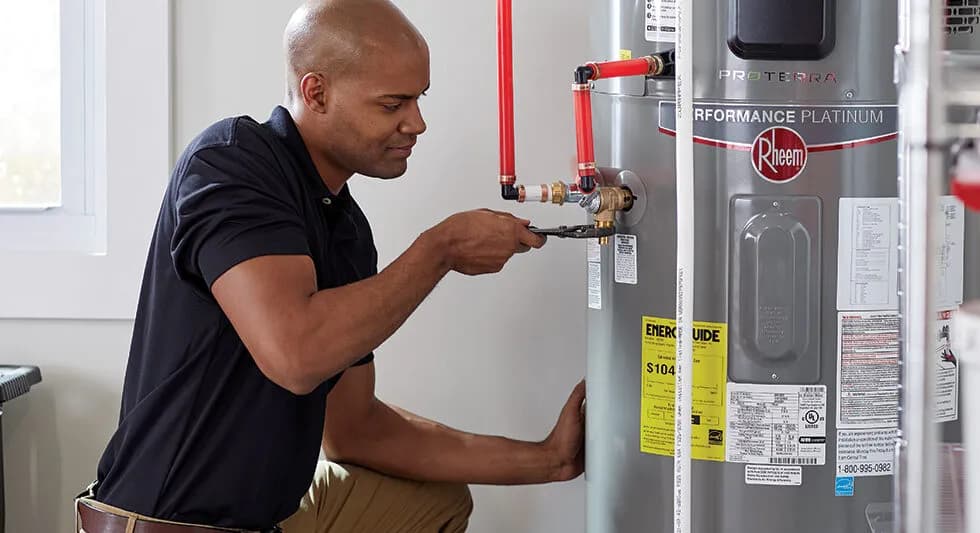 Plumber installing water heater