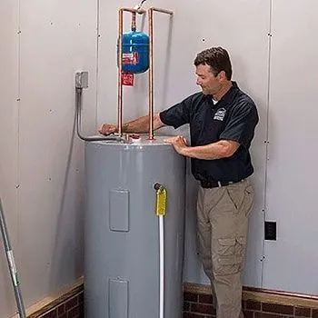 Technician installing Vulcan 315L Twin Element Electric Water Heater.
